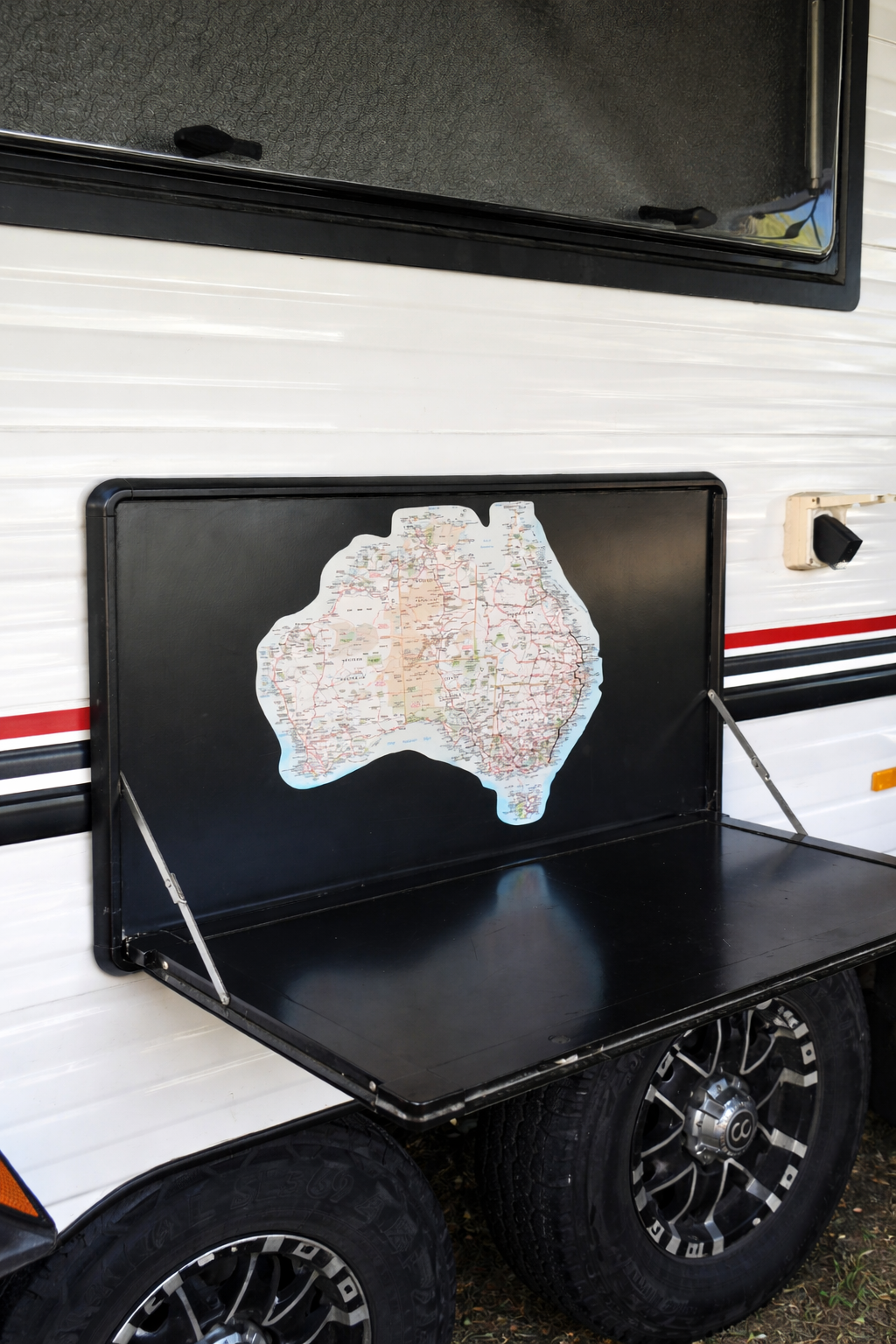 Vanaway Australian travel map sticker displayed on a caravan fold down table, designed to track road trips and camping adventures across Australia.