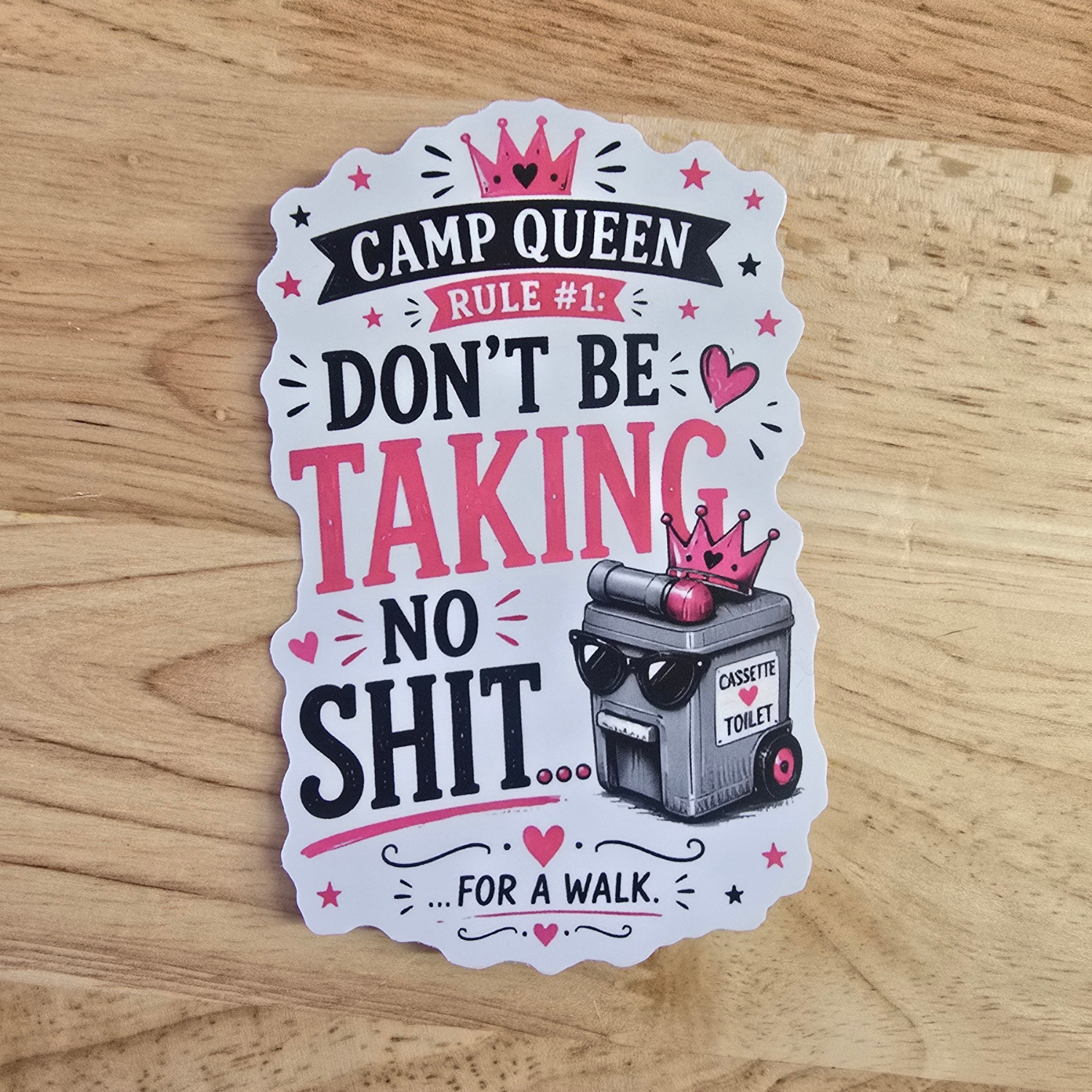 A die-cut camping sticker with a humorous slogan reading 'CAMP QUEEN RULE #1: DON'T BE TAKING NO SHIT.