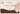 A Vanaway Caravan Essentials gift card with a cream background, dusty pink wave shapes, dark brown lower section, and printed text reading 'GIFT CARD' and 'a gift for you'.