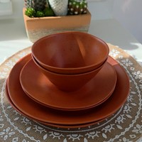 Vanaway Speckled Spice rPET caravan dinnerware place setting featuring a dinner plate, side plate and bowl stacked together, showcasing the warm terracotta speckled finish. asymmetrical dinnerware
