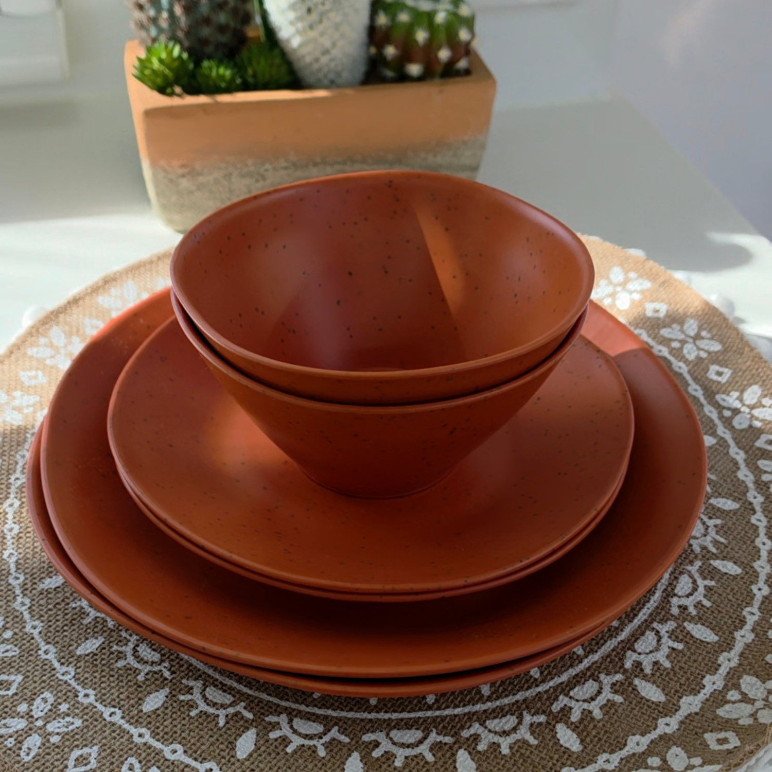 Vanaway Speckled Spice rPET caravan dinnerware place setting featuring a dinner plate, side plate and bowl stacked together, showcasing the warm terracotta speckled finish. asymmetrical dinnerware