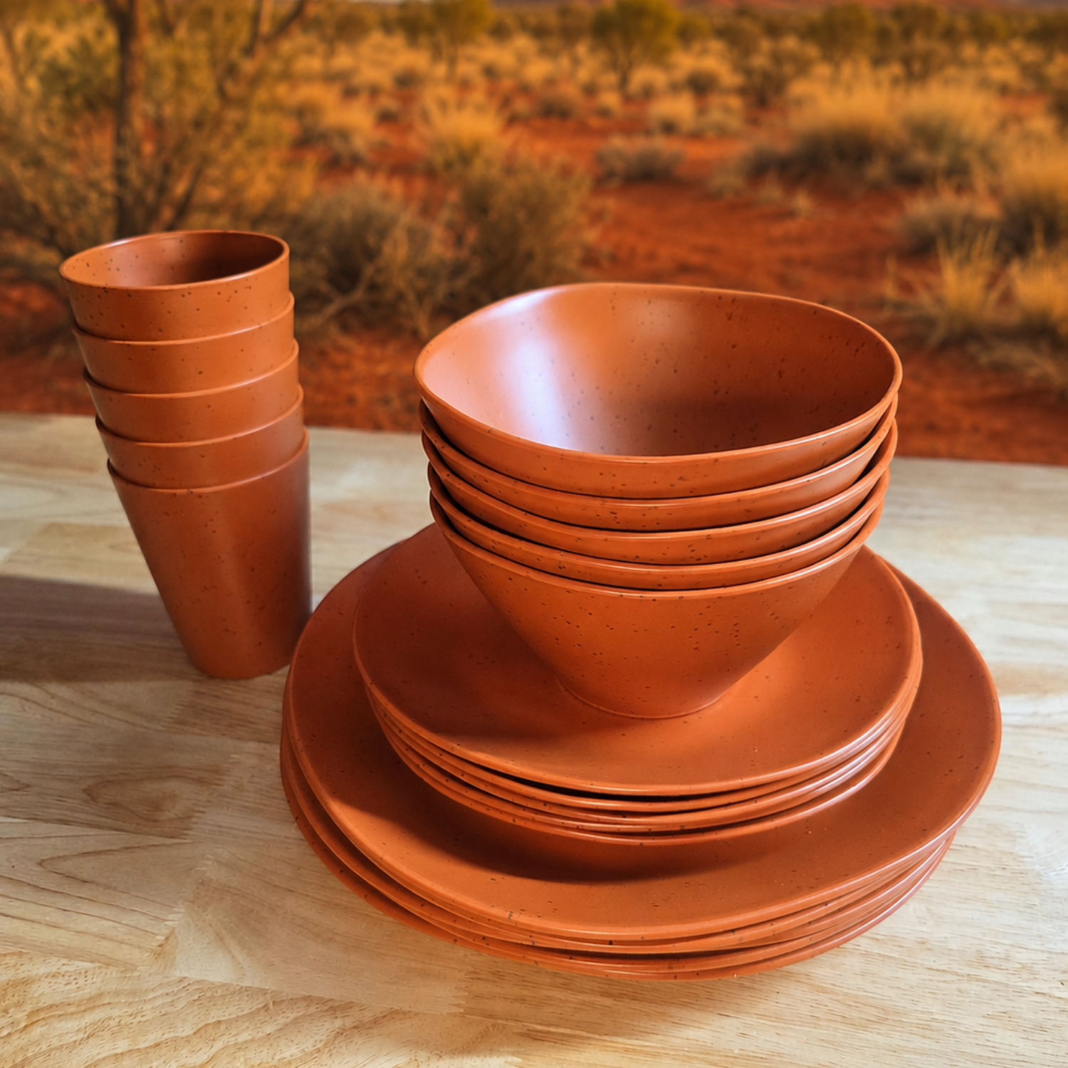 Vanaway Speckled Spice rPET caravan dinnerware set featuring stacked dinner plates, side plates, bowls and tumblers in a warm terracotta finish, displayed together to showcase the complete collection. asymmetrical dinnerware
