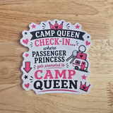 A die-cut sticker with a white background and a scalloped edge, featuring pink and black text that reads 'CAMP QUEEN CHECK-IN.
