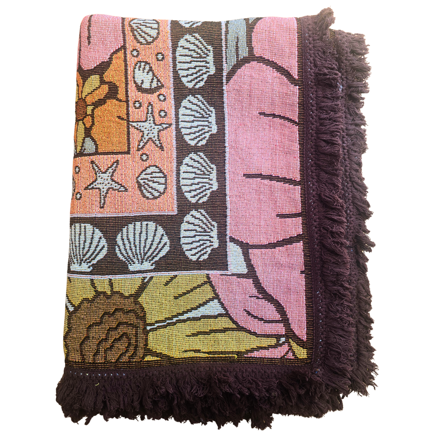 Folded Vanaway Sunblossom woven travel throw rug, showcasing the floral design, woven texture and soft fringe edges.